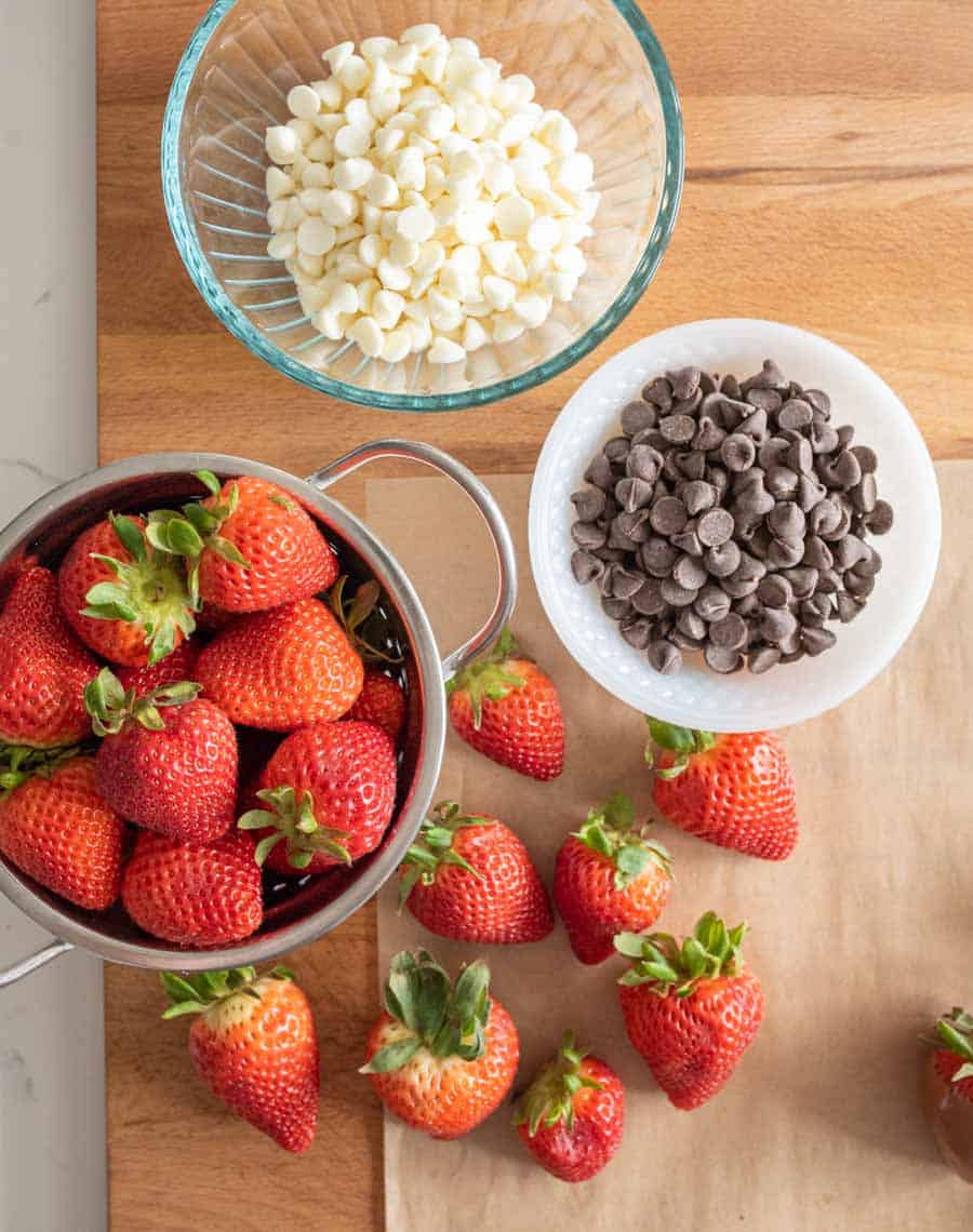 chocolate chips and fresh strawberries ready to melt and dip