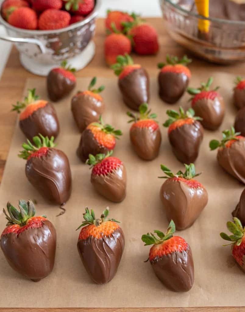 chocolate covered strawberries on parchment paper