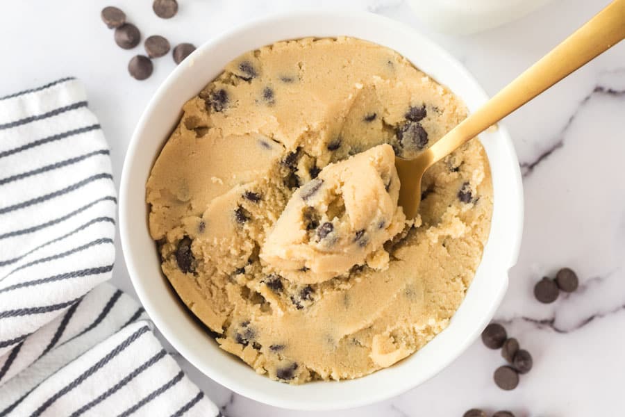 mixing bowl of cookie dough and a spoon