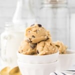 white bowls of round scoops of edible cookie dough