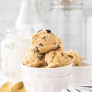 white bowls of round scoops of edible cookie dough