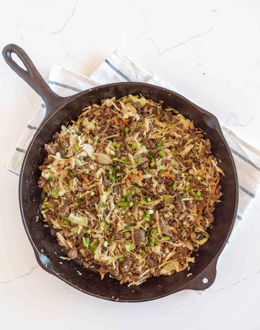 eggroll in a bowl served from a cast iron skillet