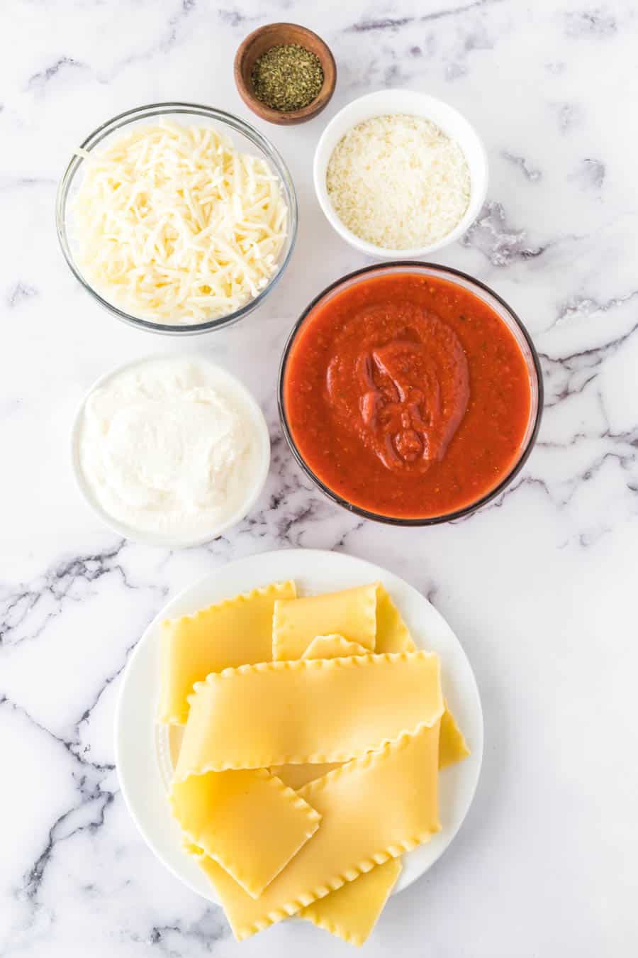 lasagna roll up ingredients on a marble table