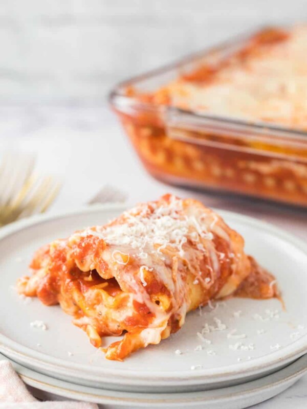 lasagna roll up served on a white plate