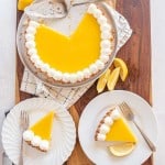 top view of lemon tart with servings dished onto white plates