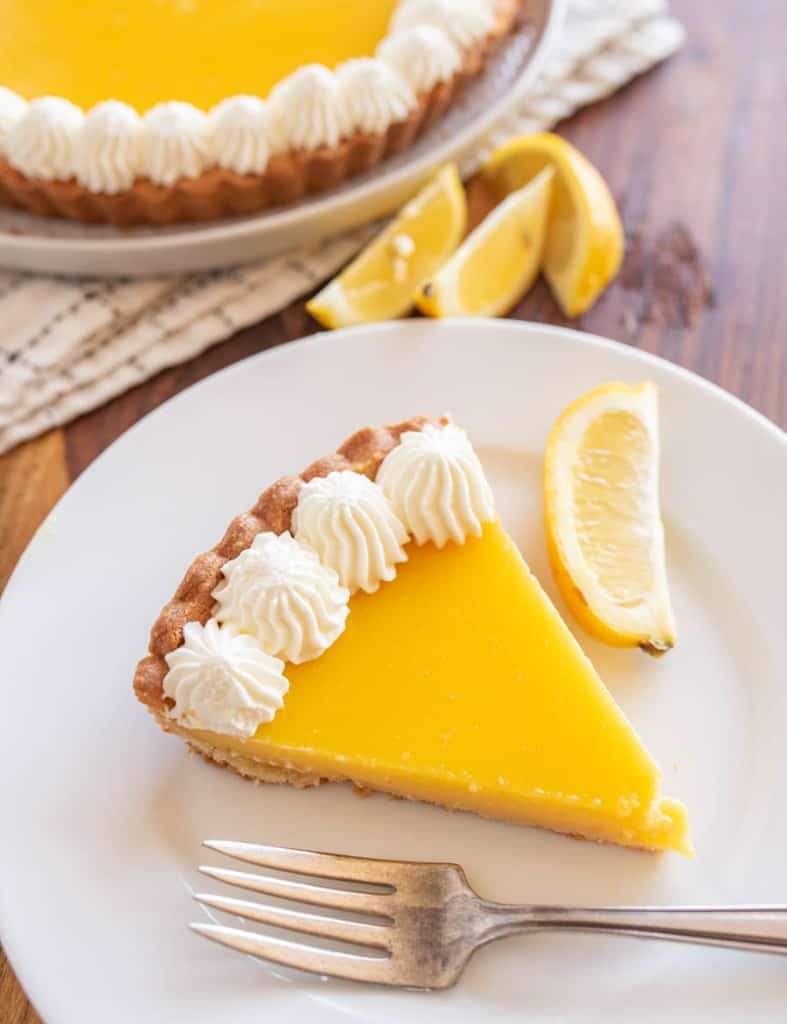 one slice of lemon tart served on a plate