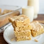 peanut butter brownies in a stack on a white plate