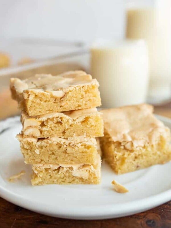 peanut butter brownies in a stack on a white plate