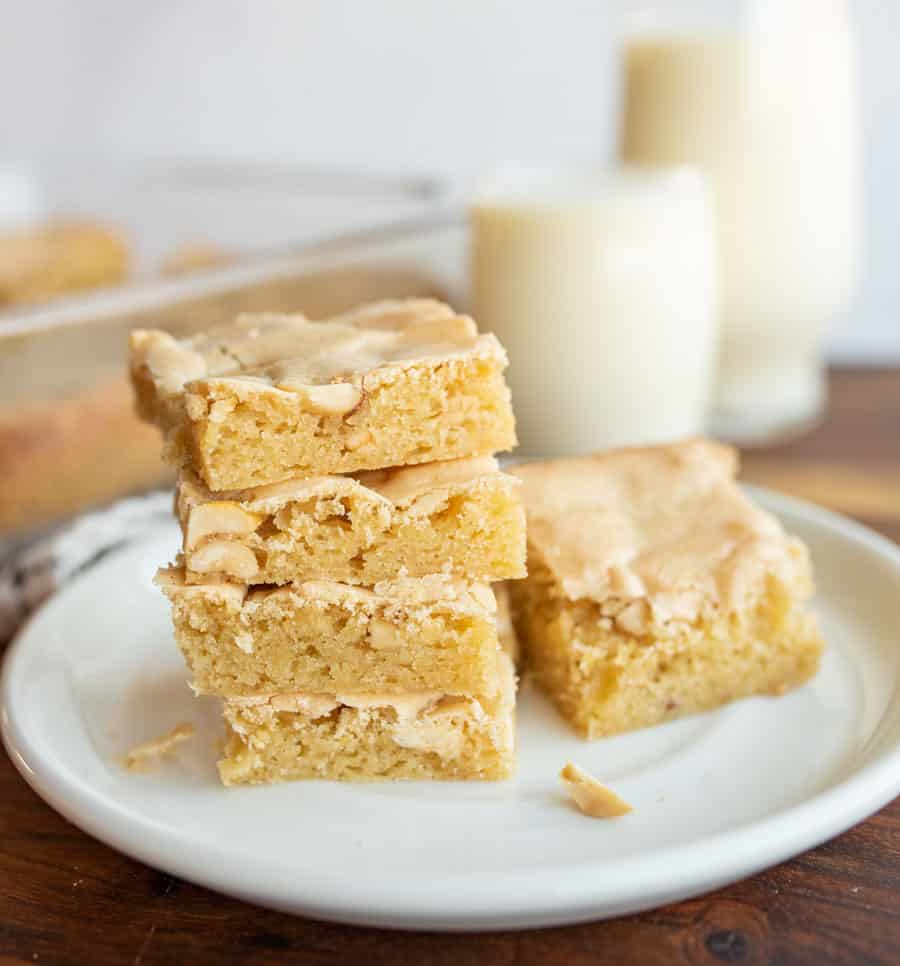 peanut butter brownies in a stack on a white plate