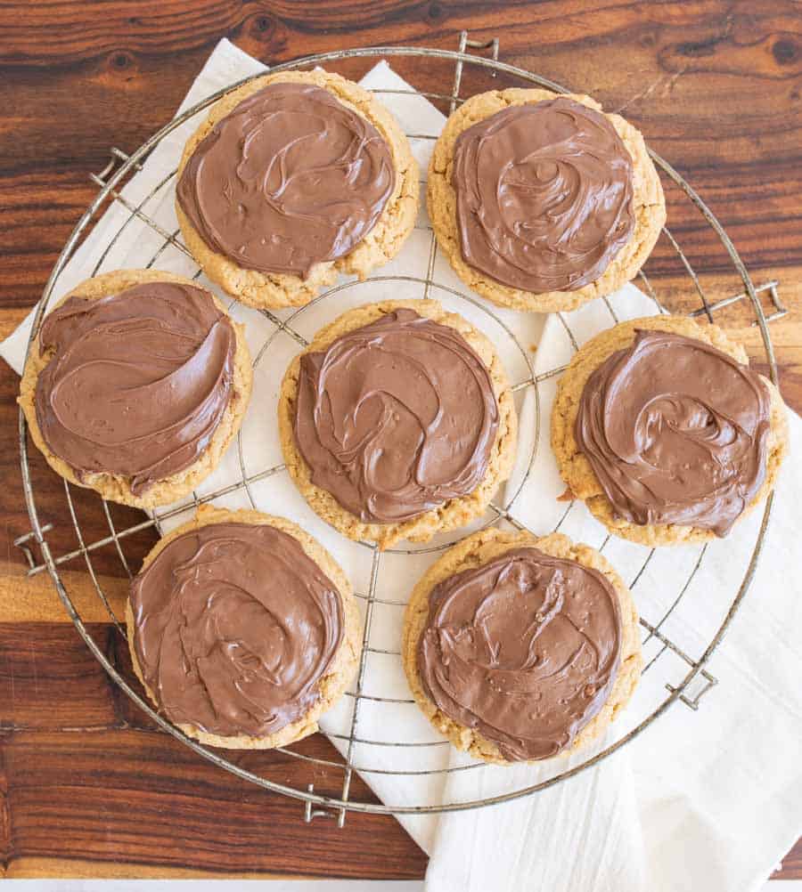 peanut butter nutella cookies on a round drying rack