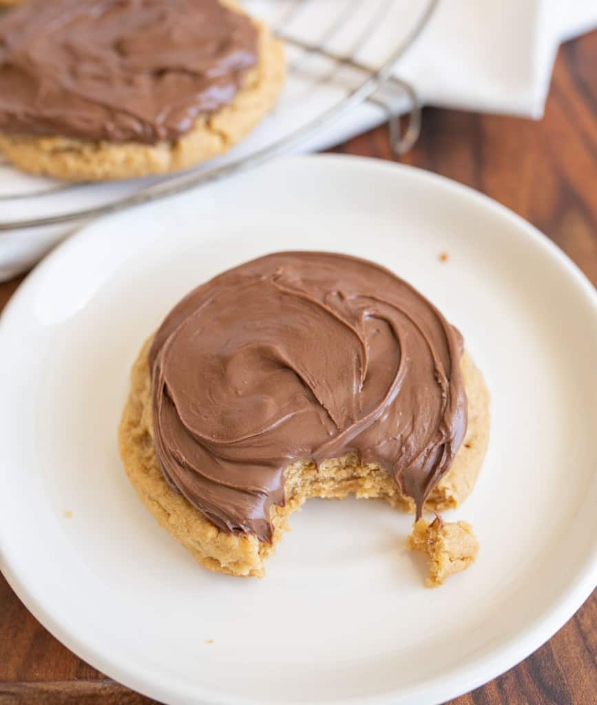 peanut butter nutella cookie with a bite out of it on a plate