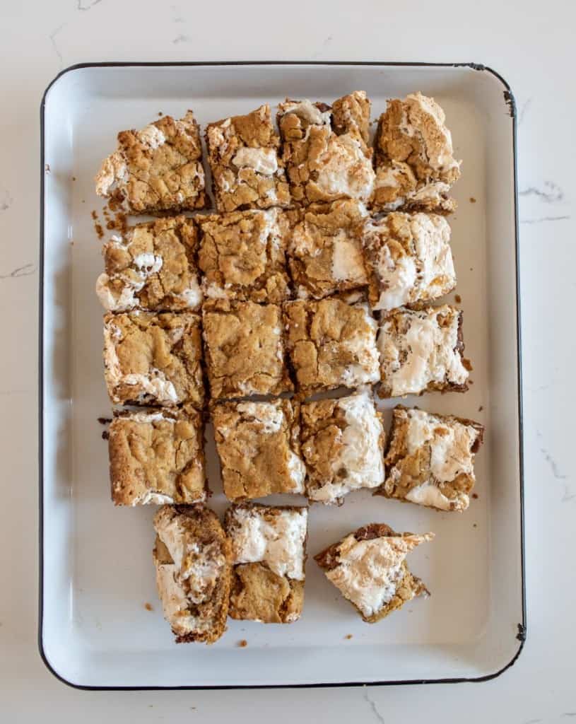 smores cookie bars cut into squares and on a white plate