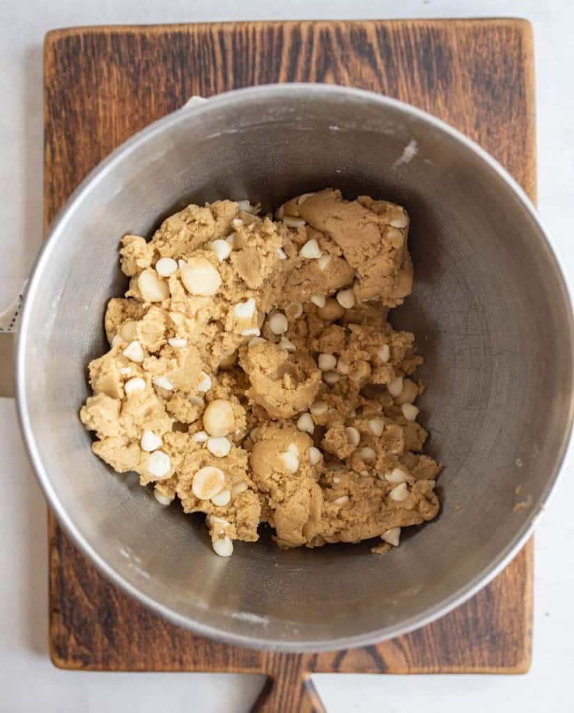 white chocolate macadamia nut cookie dough in a mixing bowl