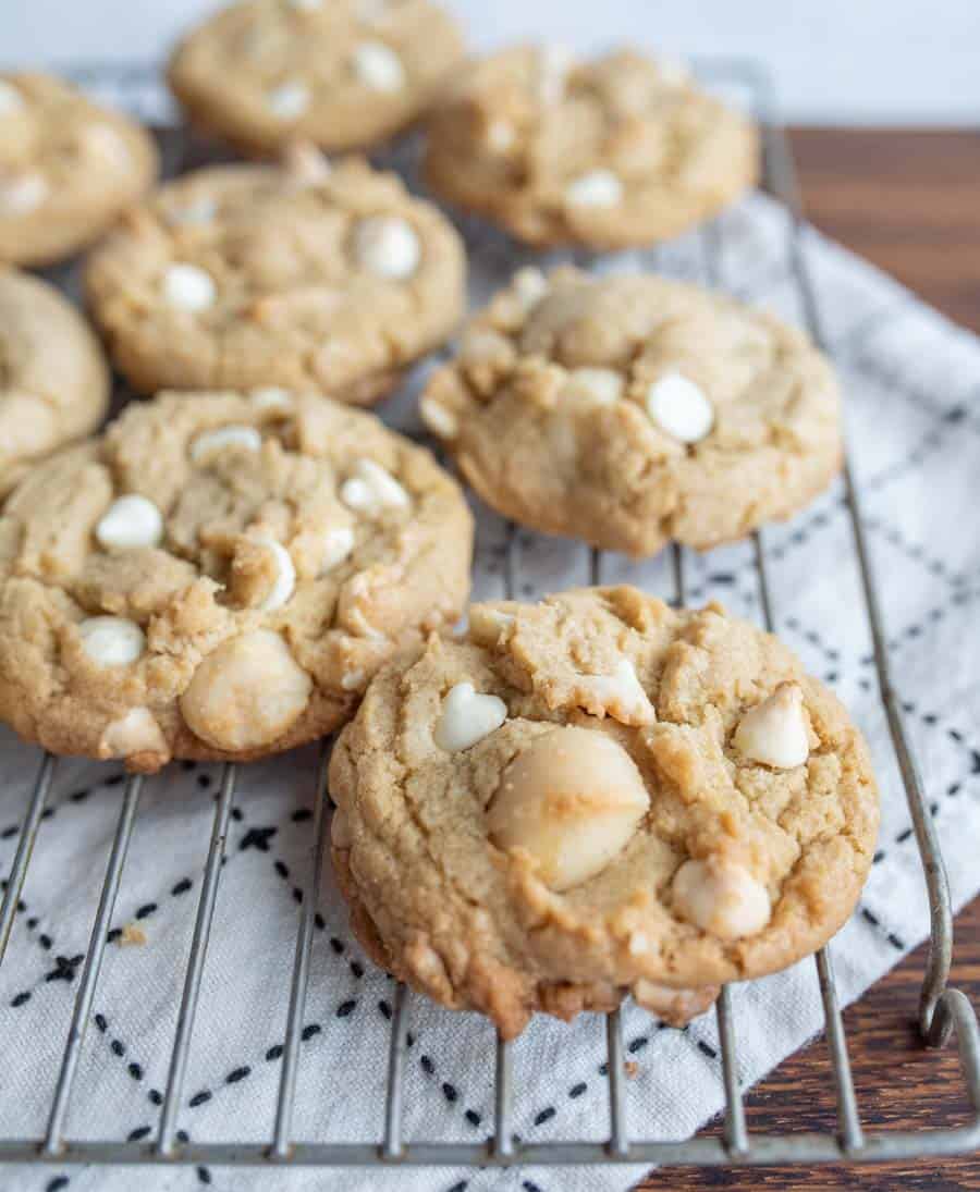 row of macadamia white chocolate chip cookies on cooling rack