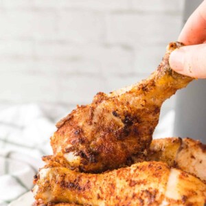 close up of air fryer chicken legs and their crispy brown skin