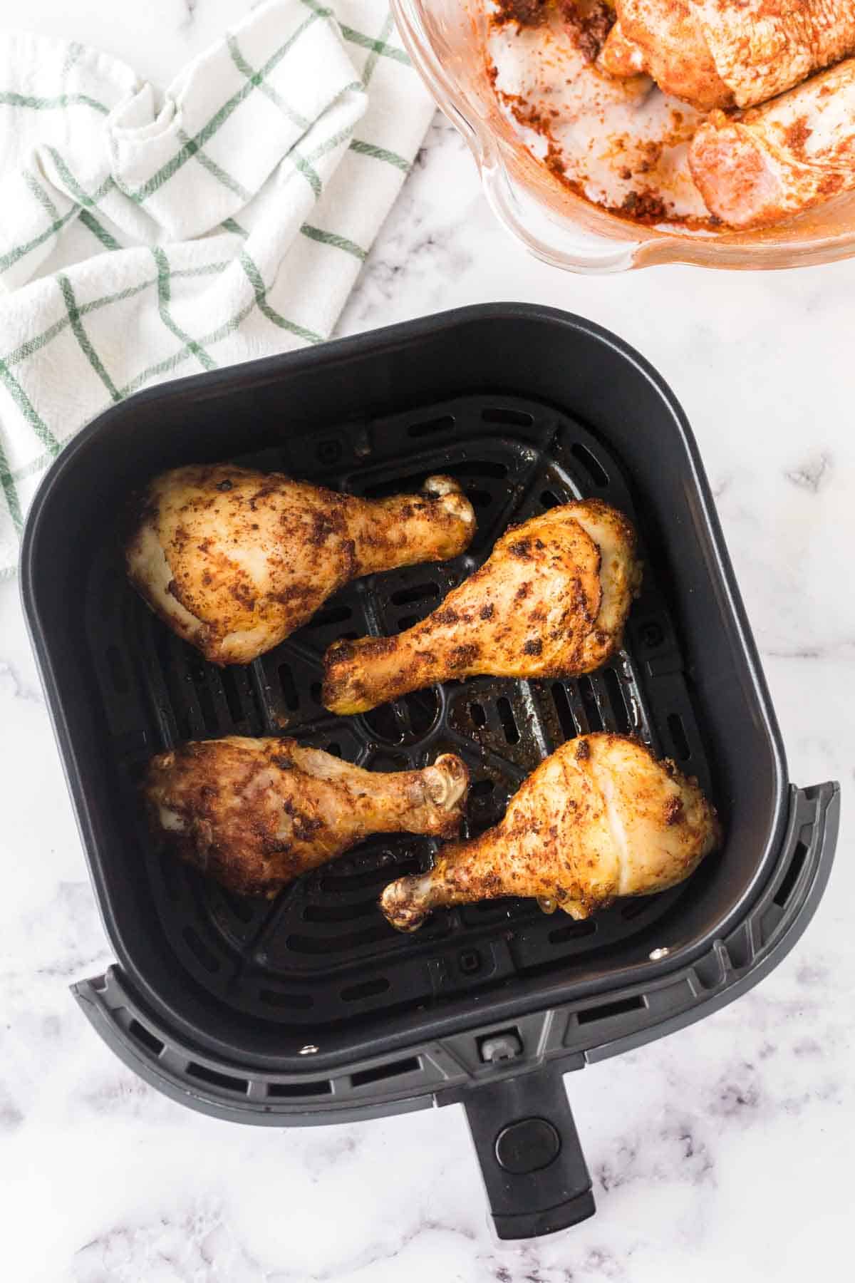 air fryer with four crispy chicken legs