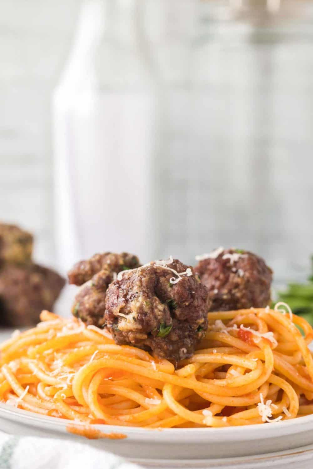 baked meatballs on spaghetti pasta