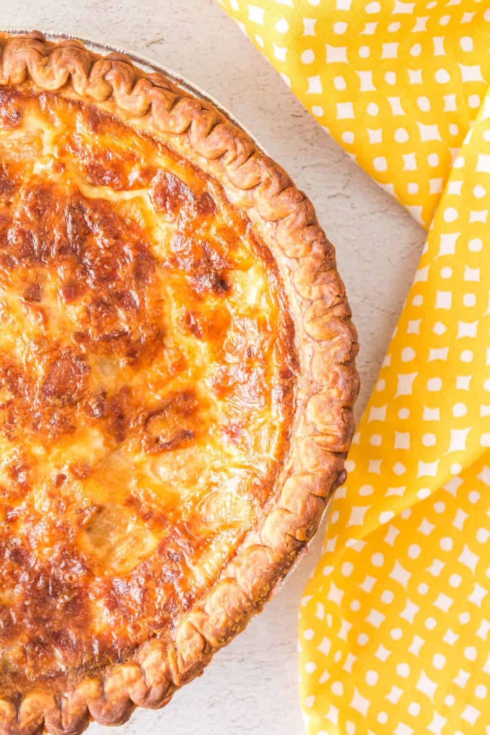 top view of a whole baked quiche lorraine