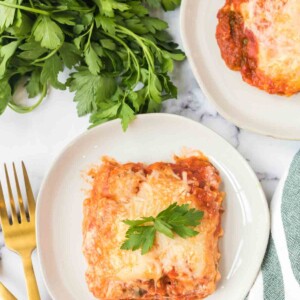 top view of one square serving of lasagna on a white plate