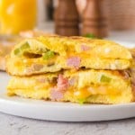 cooked denier omelet cut in half to see the cheesy inside