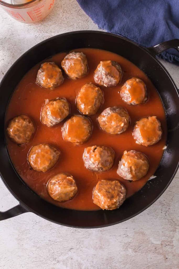 Porcupine meatballs in a skillet.