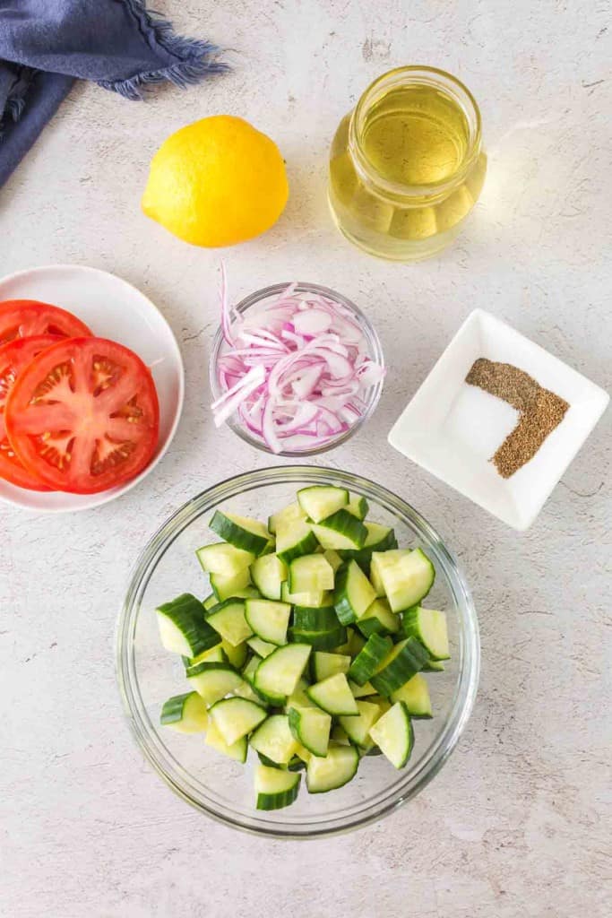 Ingredients for cucumber and tomato salad.