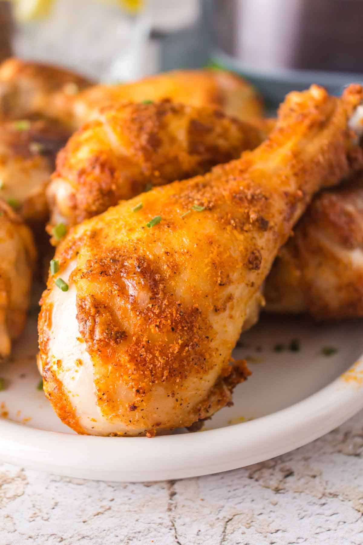 golden crisp air fried chicken drumsticks close up