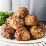 air fryer meatballs stacked on a plate