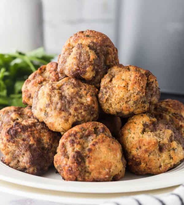 air fryer meatballs stacked on a plate