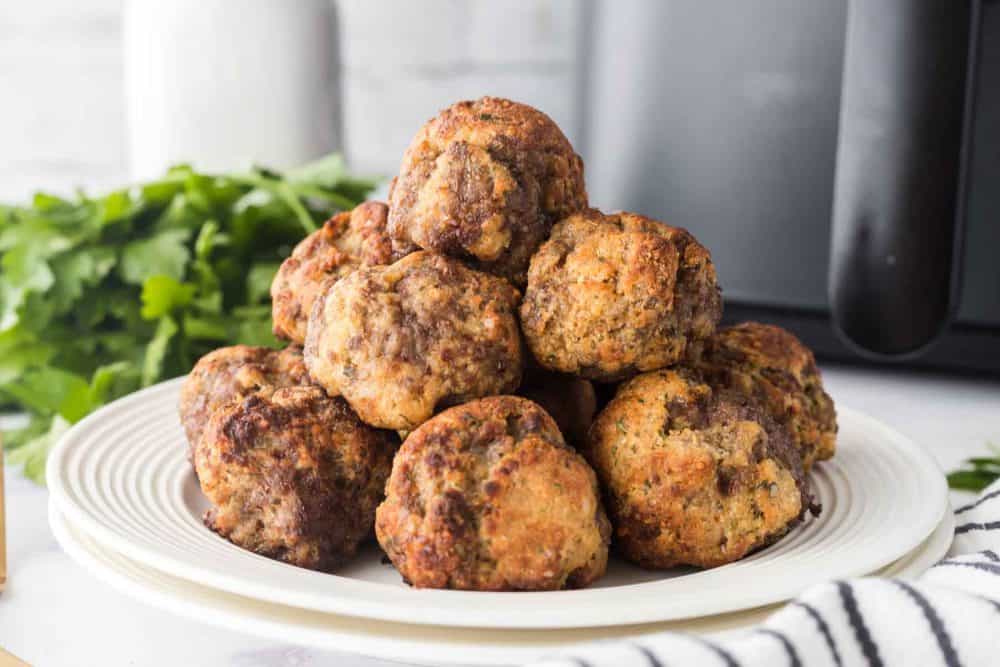 air fryer meatballs stacked on a plate