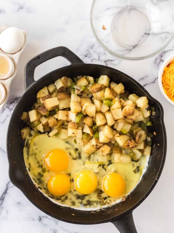 raw ingredients being cooked for breakfast skillets