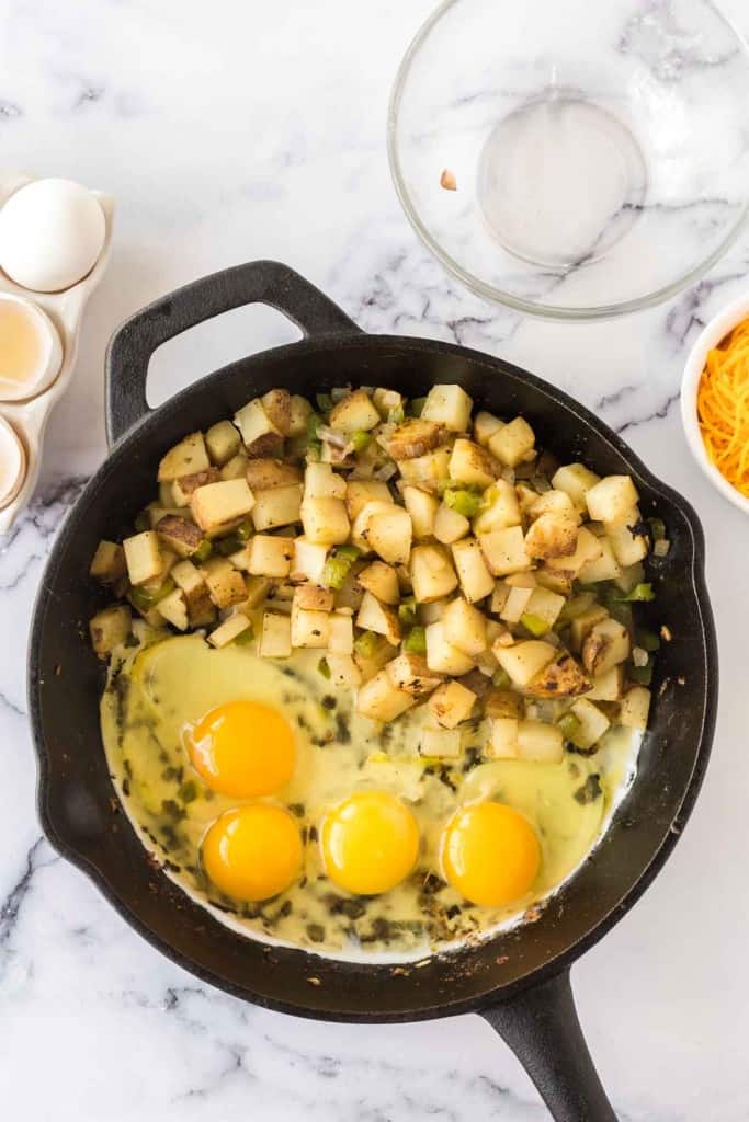 raw ingredients being cooked for breakfast skillets