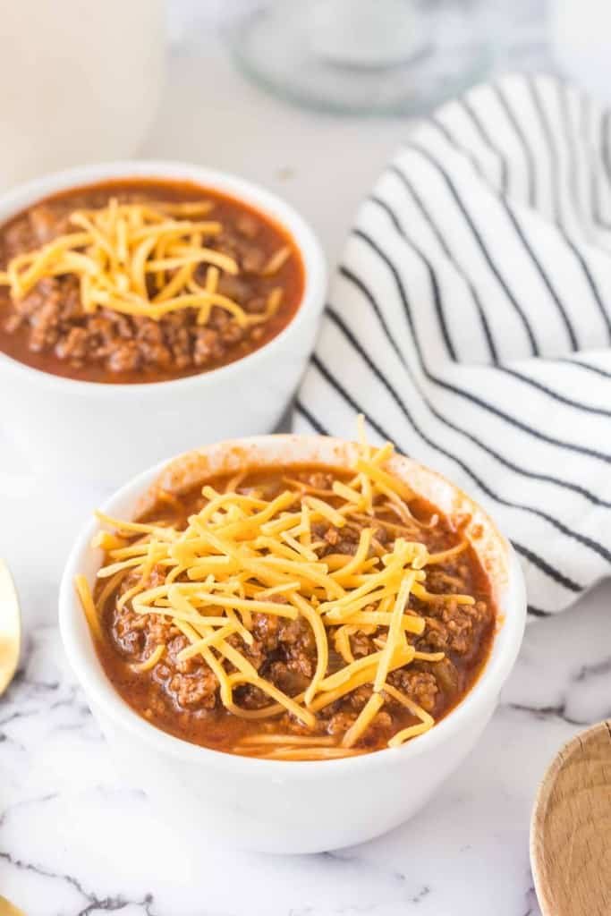 Cincinnati chili served in white bowls. 