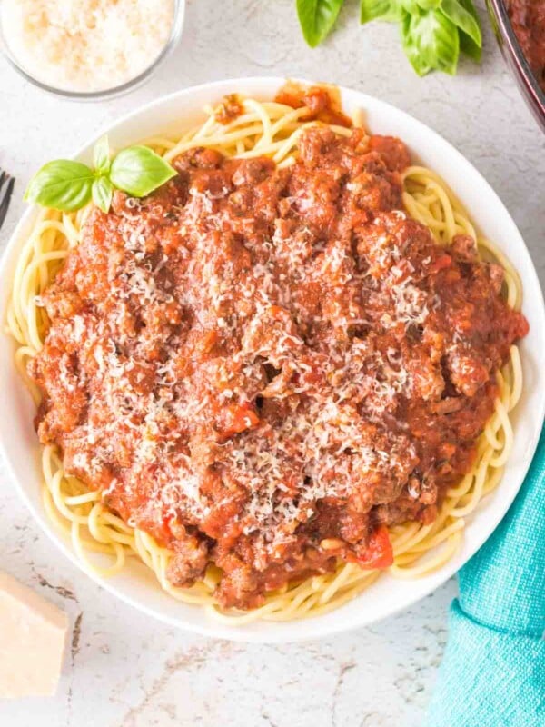 top view of easy homemade spaghetti sauce on pasta on a white plate