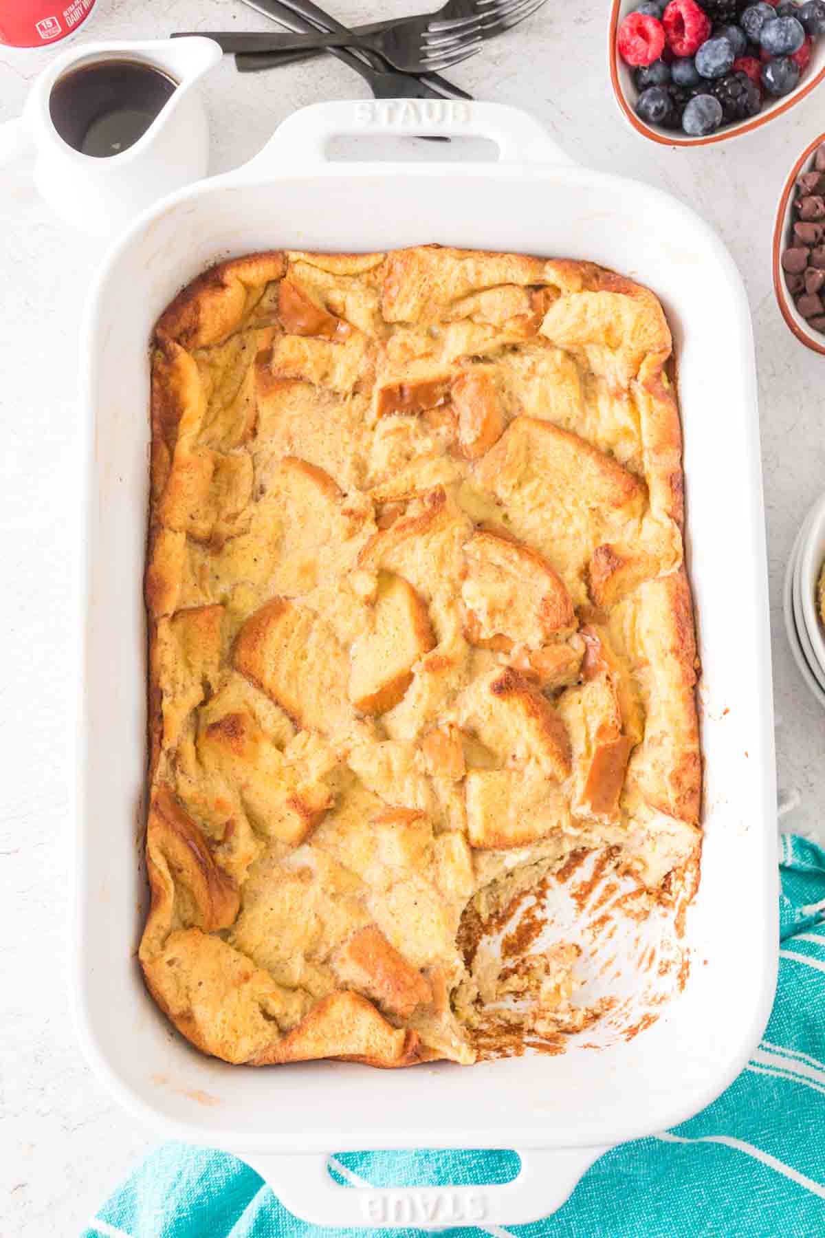 white rectangle baking dish with the ingredients of the french toast bake recipe