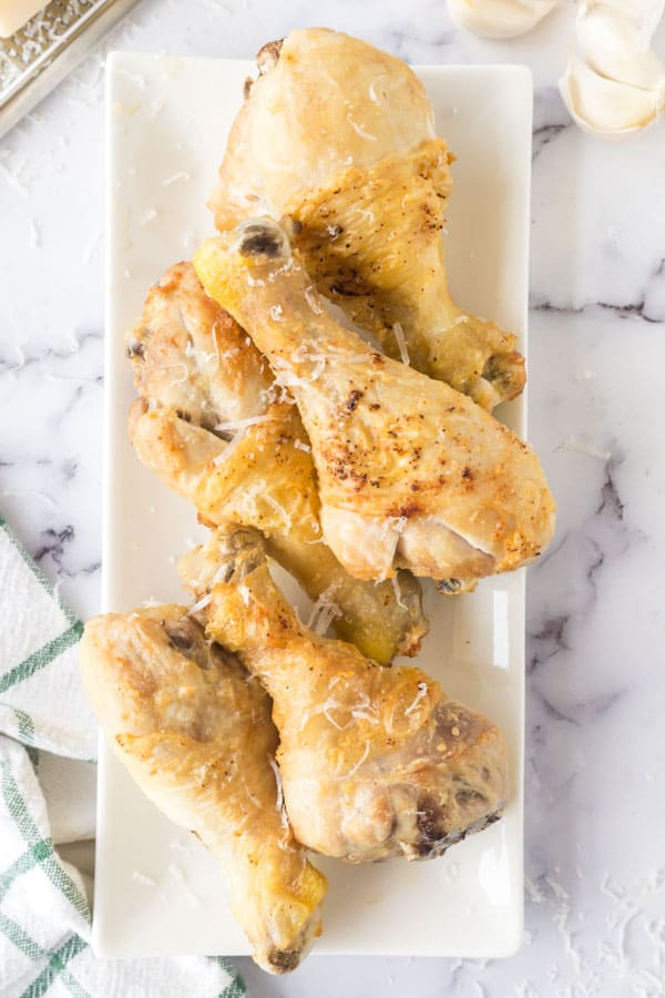 garlic parmesan air fryer chicken wings lined on a plate
