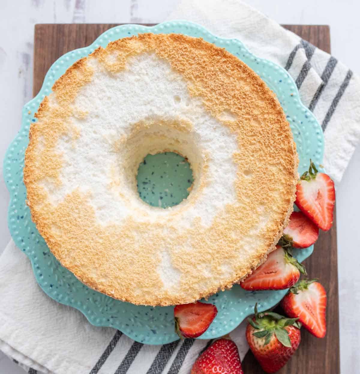 top view of the circled shaped angel food cake on a blue plate
