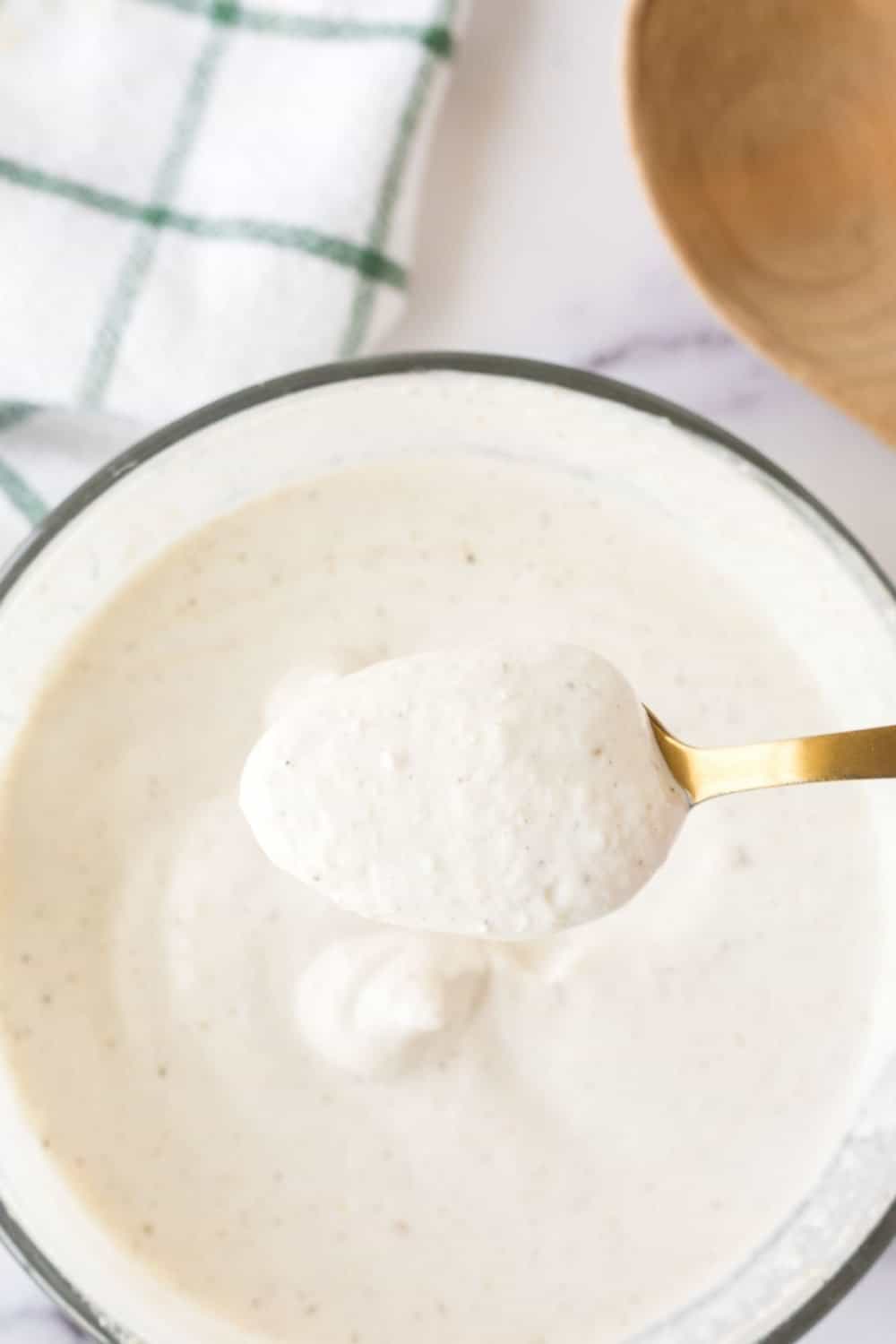 horseradish sauce in a bowl with a POV spoon