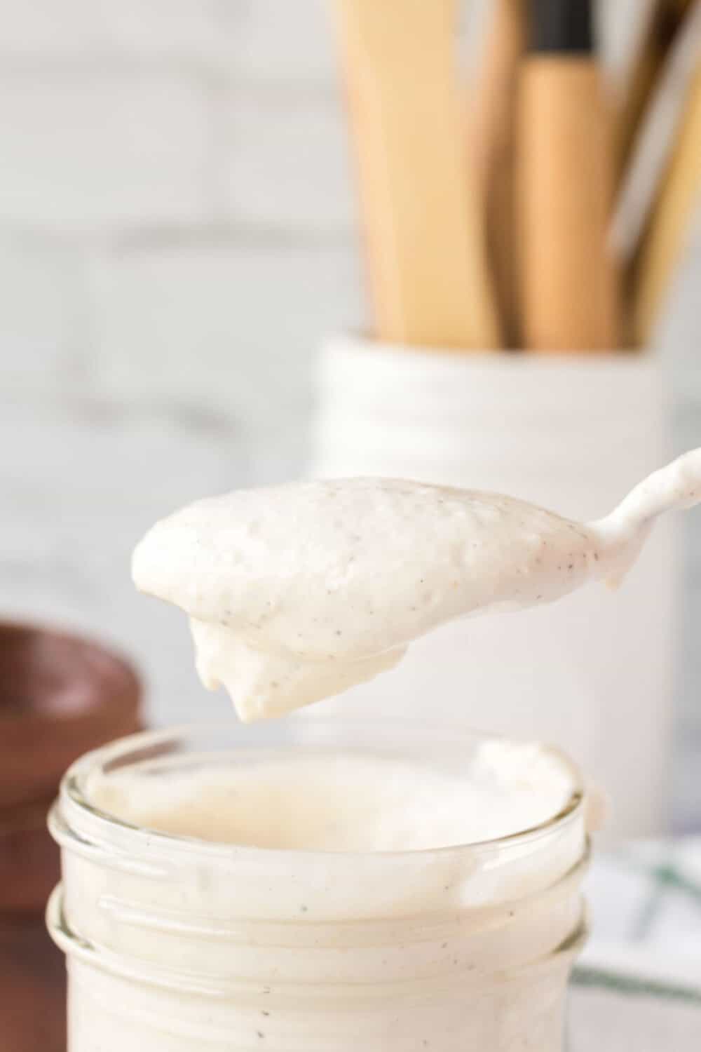 horseradish sauce spooned out of a mason jar