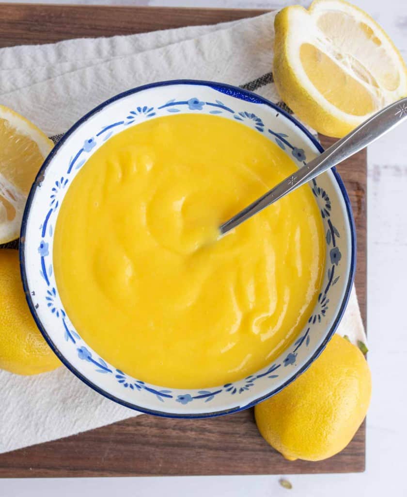 top view of bright yellow lemon curd in a bowl