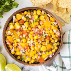 mango salsa in a wooden mixing bowl