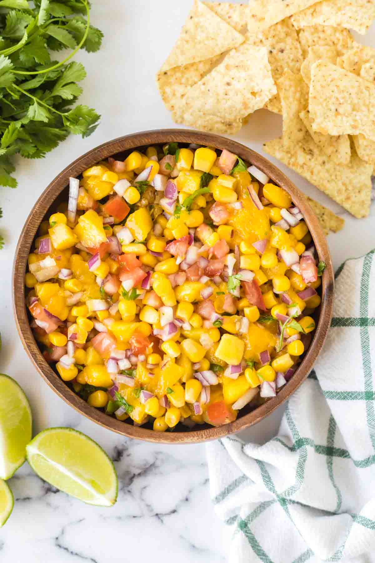 mango salsa in a wooden mixing bowl