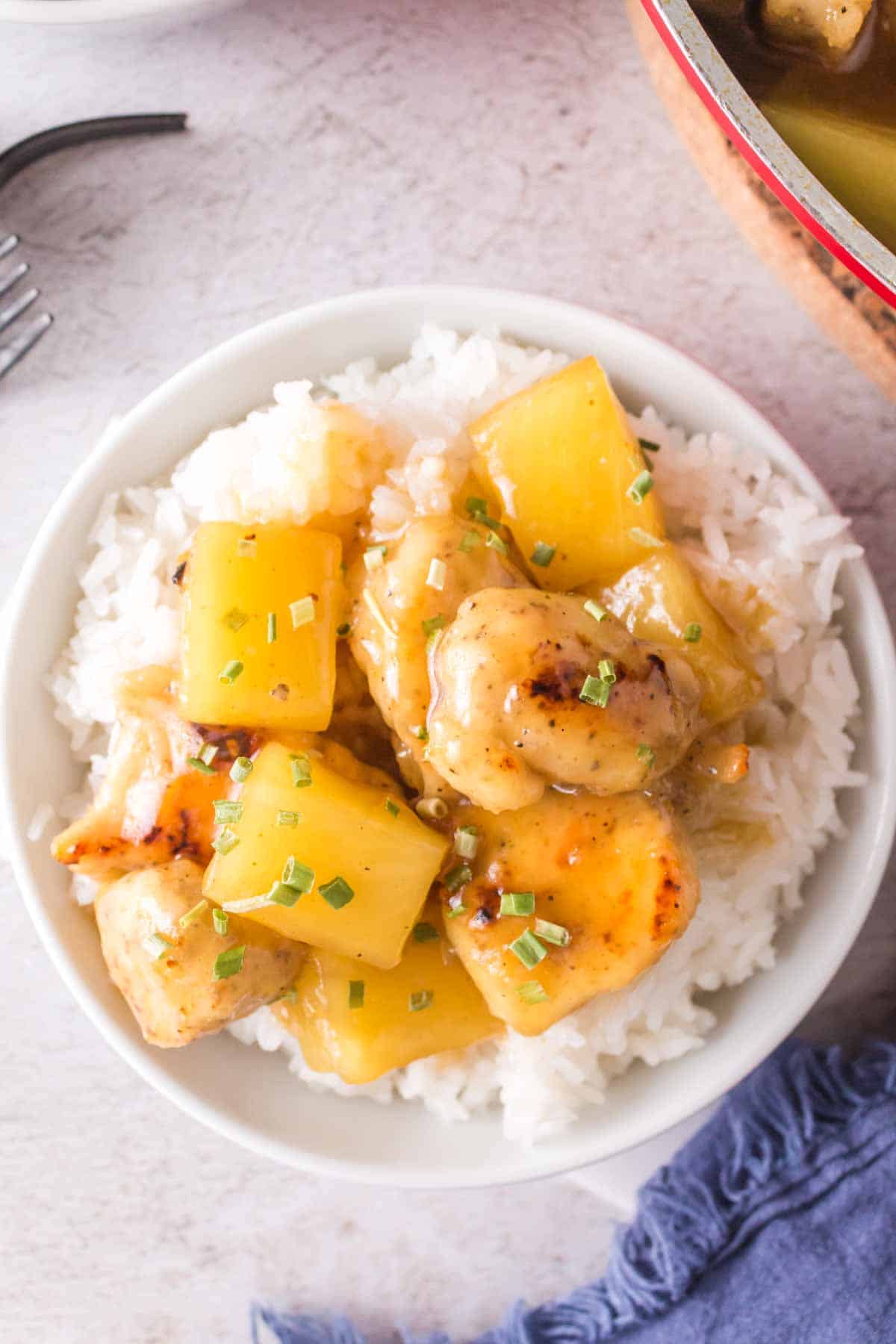 Pineapple chicken served over rice.