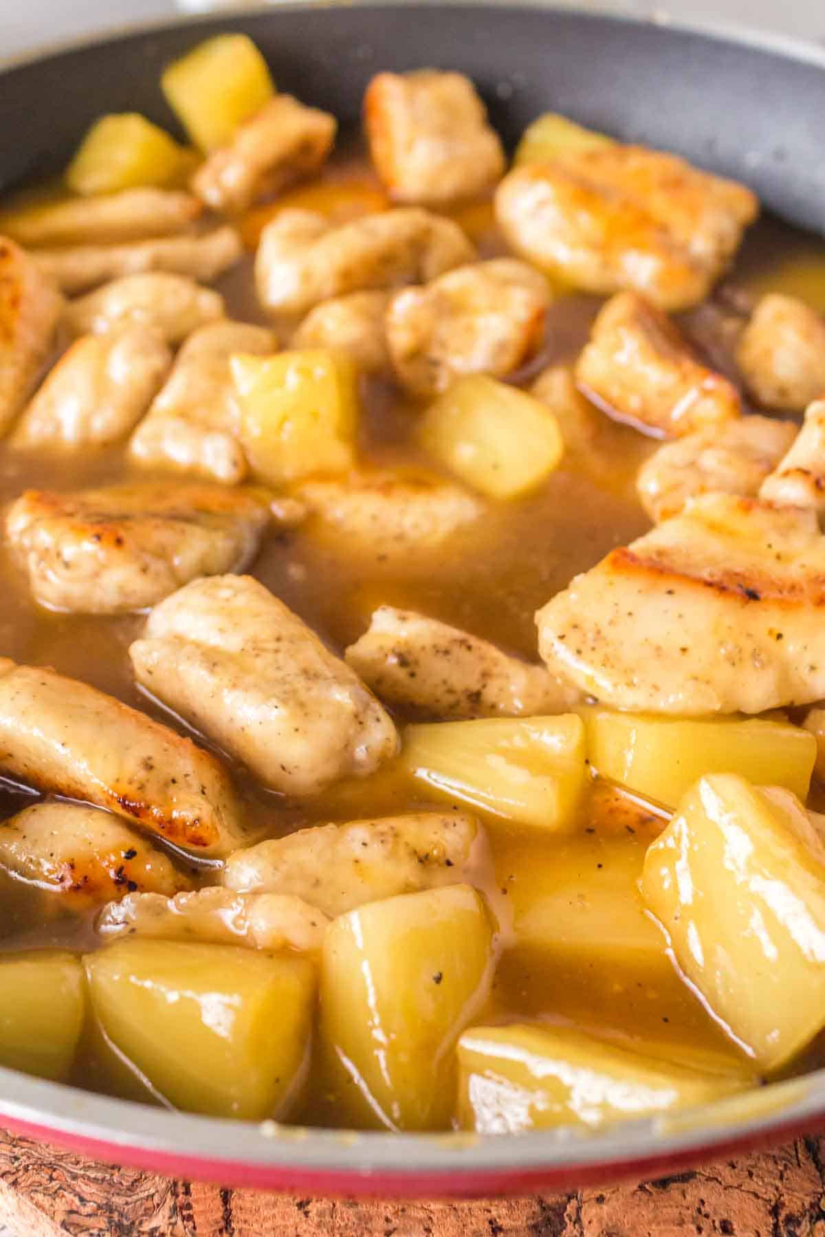 pineapple chicken cooking in the pan.