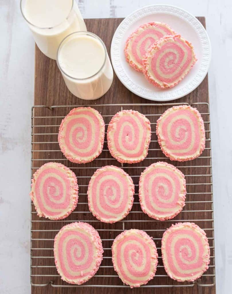top view of pink pinwheel cookies and milk