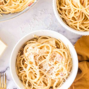 spaghetti carbonara in white bowls