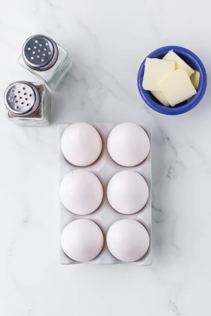 Ingredients for making sunny side up eggs.