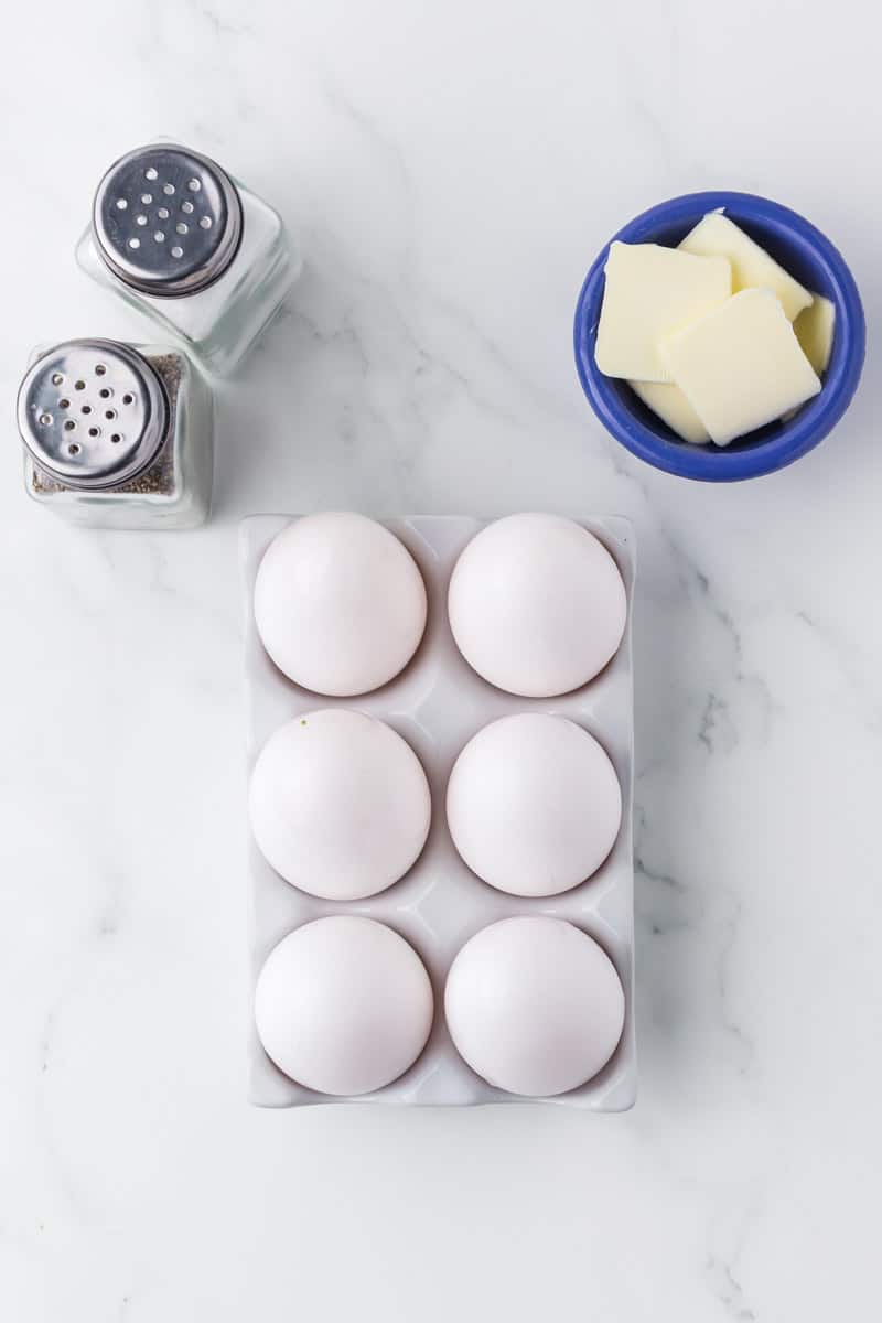 Ingredients for making sunny side up eggs.