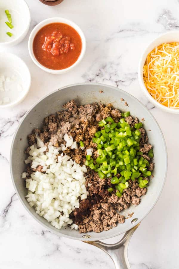 taco casserole meat ingredients in a pan