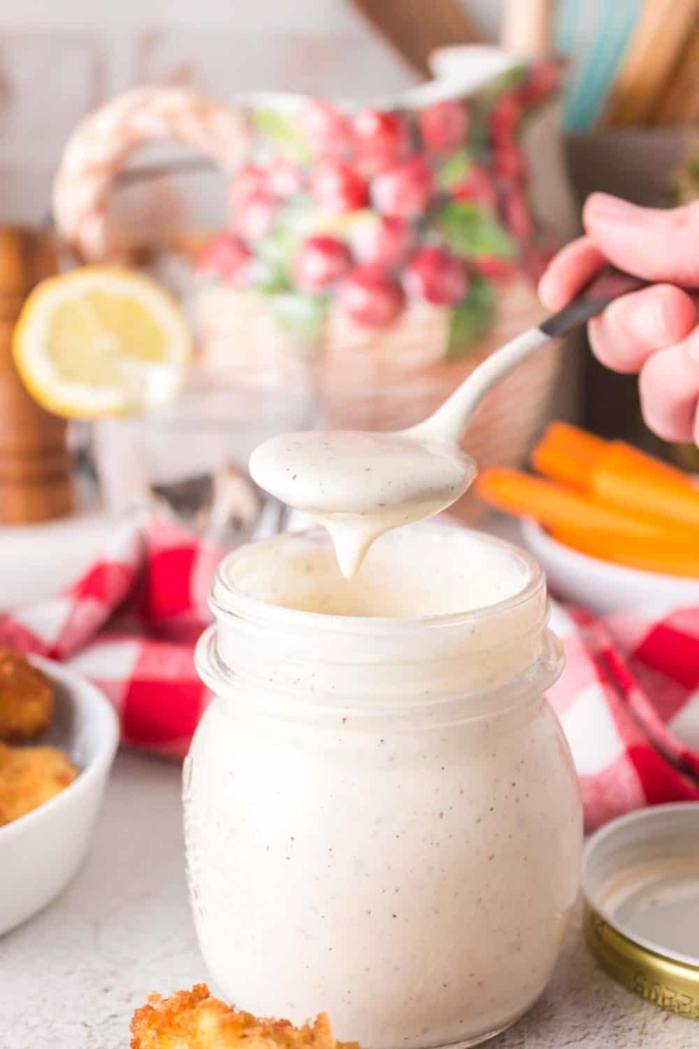 Jar full of white BBQ sauce